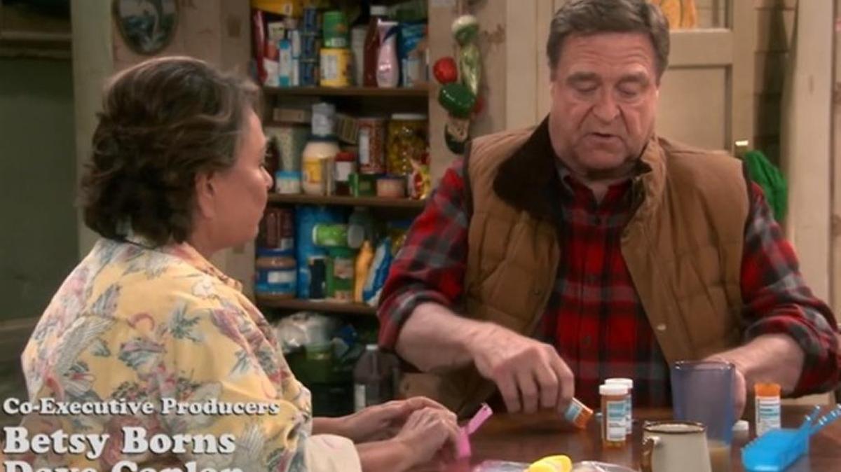 Screenshot of the revival premiere of “Roseanne,” in which the show’s namesake and husband, Dan, divvy up prescription medications.