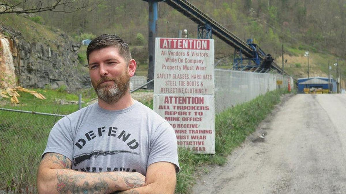 Gary Bentley stood outside the mine where he worked before being laid off in 2012.