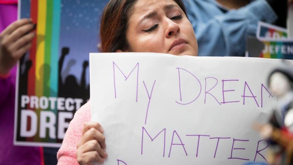 Evelin Hernandez, 27, cried as she helds a sign, “My dreams matter. Don’t shatter them,” during a protest in Minneapolis after President Donald Trump announced on Sept. 5 plans to rescind a program that protected from deportation children brought illegally to this country.