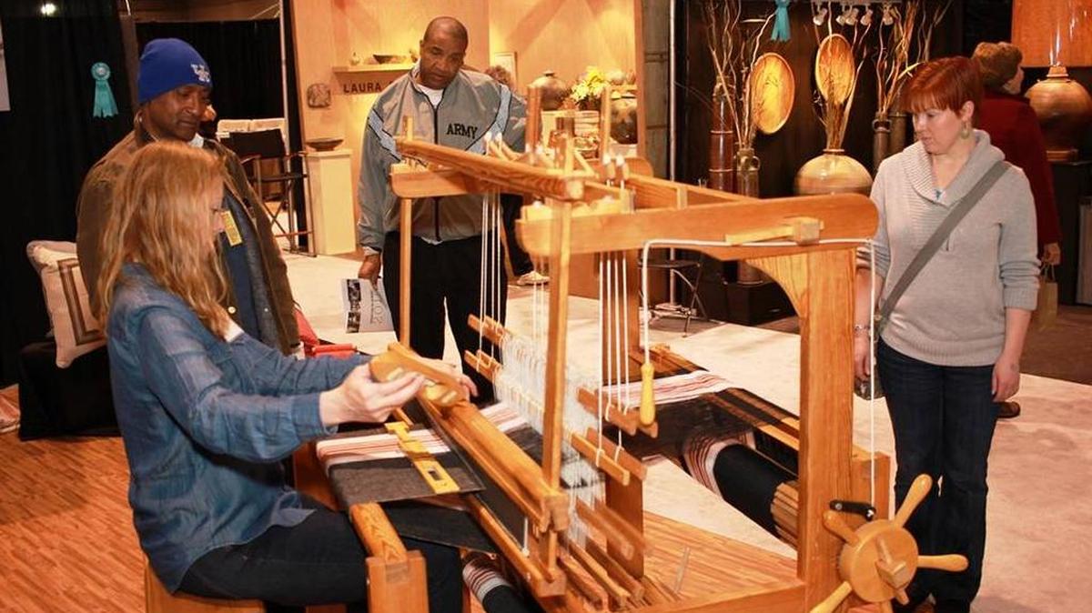 A weaver explained her craft during the 2015 Kentucky Crafted: The Market sponsored by the Kentucky Arts Council.