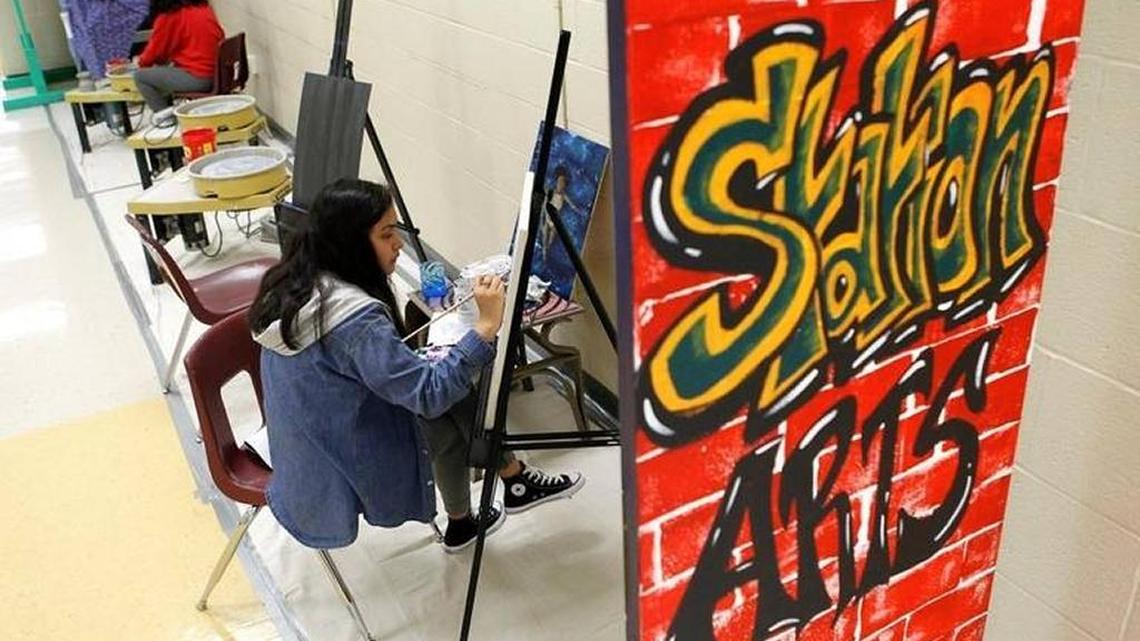 Student Mayra Lugo worked on an acrylic painting at the Academies of Bryan Station following a November reception designating Lexington as a Ford Next Generation Community.