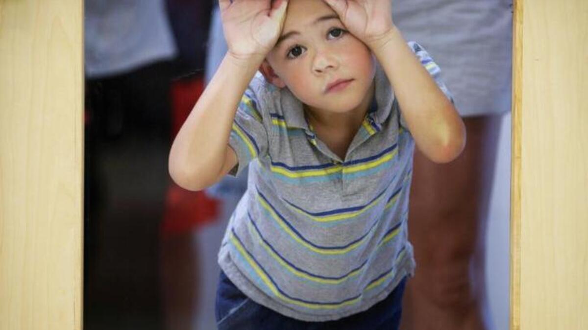 Ayden Mathew Love, 9, waited to tour Lexington’s new Coventry Oak Elementary last summer.