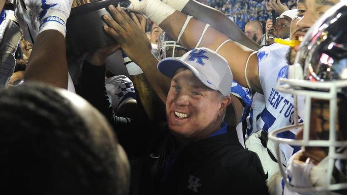 University of Kentucky football head coach Mark Stoops celebrated with his team after its win against University of Louisville on Nov. 24. UK will play Penn State University in the Citrus Bowl on New Year’s Day.