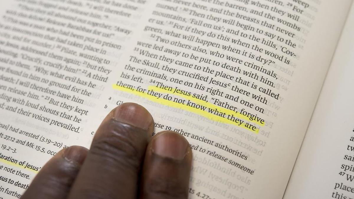 Darryl A. Burton, 54, looked over his favorite passage in the Bible, Luke 23 Psalm 34. The passage: Jesus said, "Father, forgive them; for they do not know what they are."