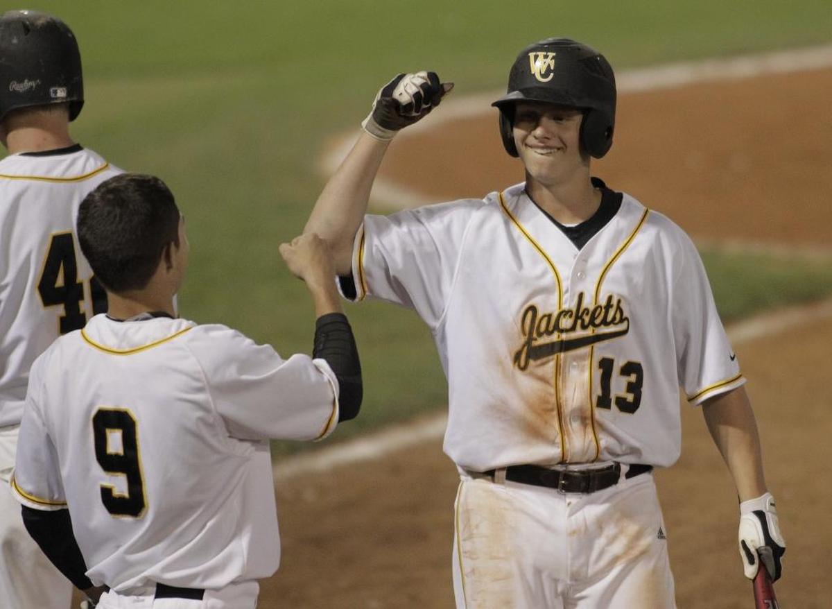 Eli Boggess (13) helped lead Woodford County to the state high school baseball championship in 2012.