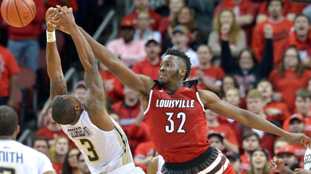 Louisville's Chinanu Onuaku (32) tips the ball from the hands of Georgia Tech's Marcus Georges-Hunt (3) during the second half of an NCAA college basketball game, Tuesday, March 1, 2016 in Louisville Ky. Louisville won 56-53. (AP Photo/Timothy D. Easley)