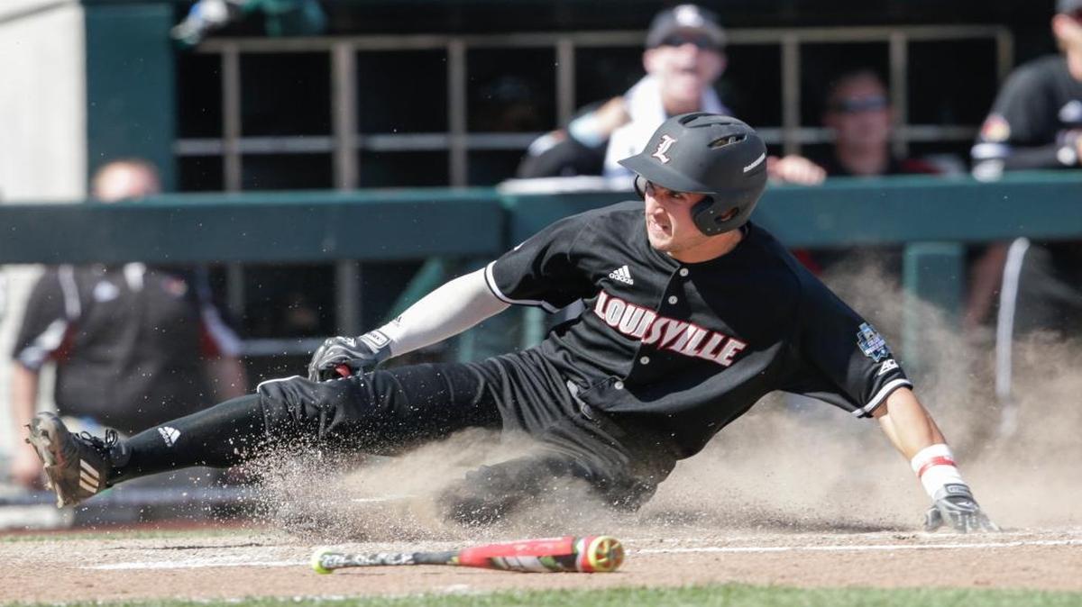 Louisville’s Ryan Summers scored on a single by Colby Fitch in the eighth inning against Texas A&M during a College World Series game in Omaha, Neb. on Sunday.