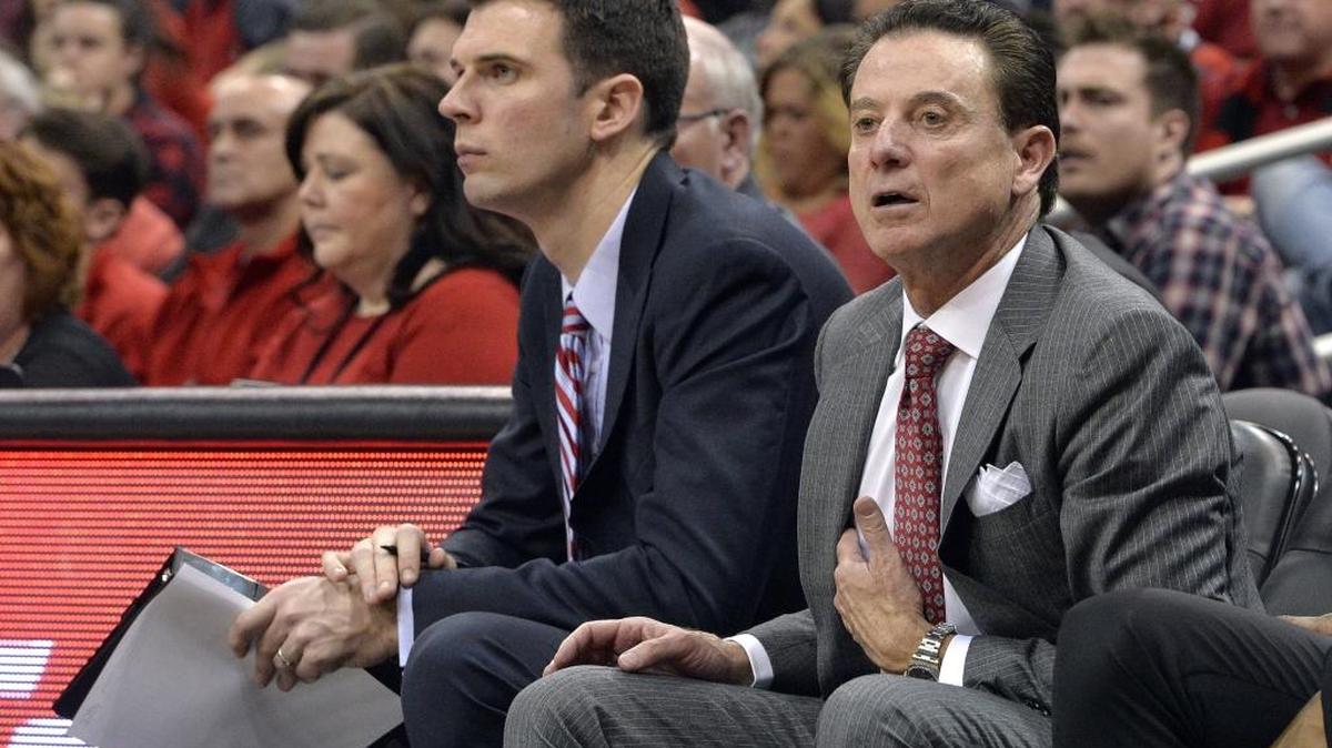 Rick Pitino, right, and David Padgett coach from the Louisville bench during a game last season.