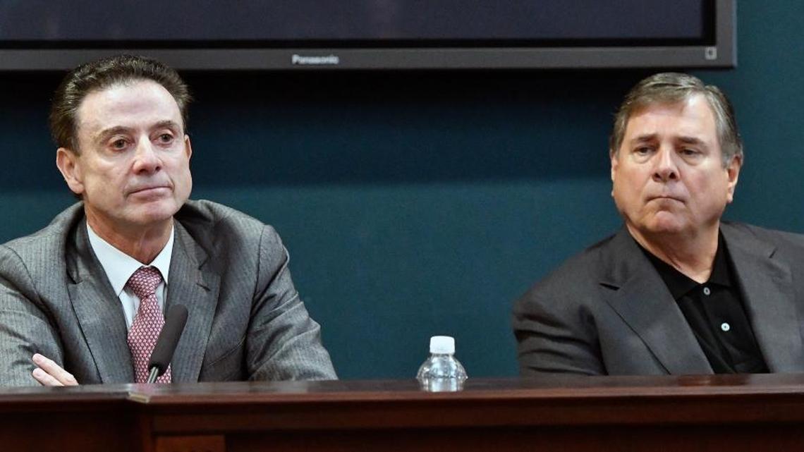 University of Louisville head basketball coach Rick Pitino, left, and Athletic Director Tom Jurich listen during a press conference, Thursday, Oct. 20, 2016, in Louisville, Ky. The NCAA has accused Louisville of four violations following an investigation that a former basketball staff member hired escorts and strippers for sex parties with recruits and players.