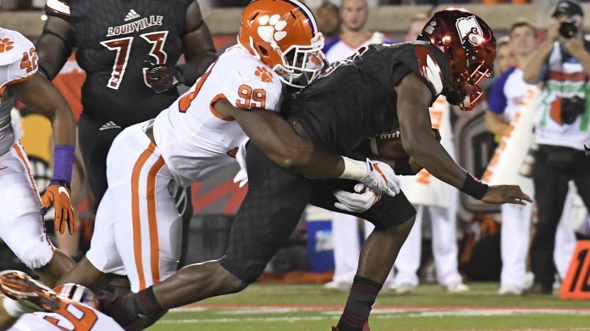 Lamar Jackson was wrapped up by Clemson’s Clelin Ferrell during the first half. “(The Louisville) offense did a horrible job tonight,” Jackson said. “It’s on all of us.”