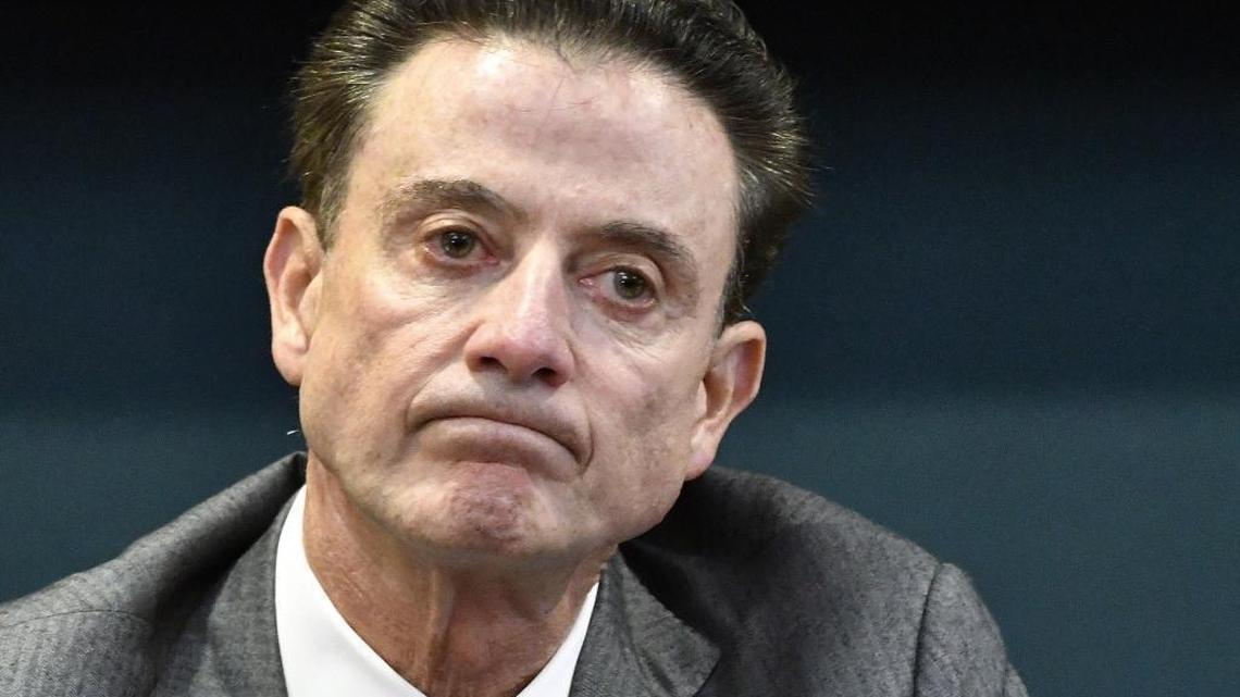 Louisville coach Rick Pitino reacts to a question during a press conference last October about the program’s scandal that alleged an assistant hiring strippers to entertain players and recruits.