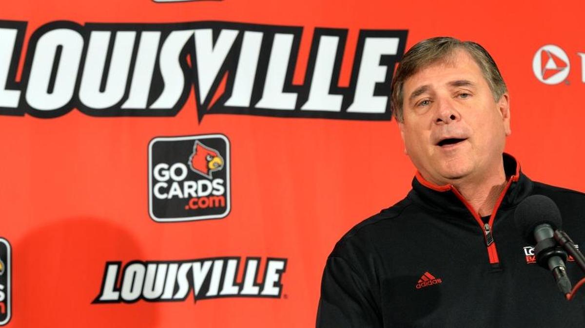 Louisville Athletic Director Tom Jurich spoke with reporters before the unveiling of the center court section from Louisville's 2013 championship before the team's NCAA college basketball scrimmage, Oct. 19, 2013, in Louisville.