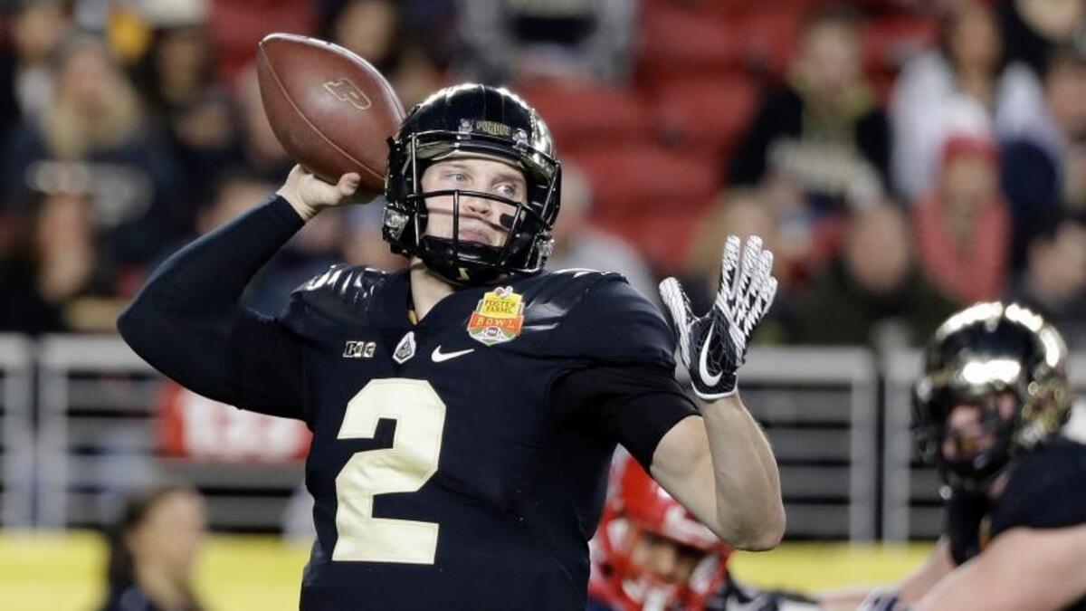 Purdue quarterback Elijah Sindelar, left, throws against Arizona during the first half of the Foster Farms Bowl NCAA college football game Wednesday, Dec. 27, 2017, in Santa Clara, Calif.