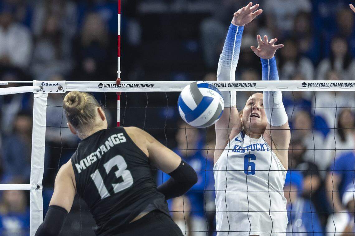 Kentucky Wildcats setter Kassie O'Brien (6) blocks a shot during the NCAA Volleyball Tournament Sweet 16 Lexington Regional at Memorial Coliseum on Thursday. 