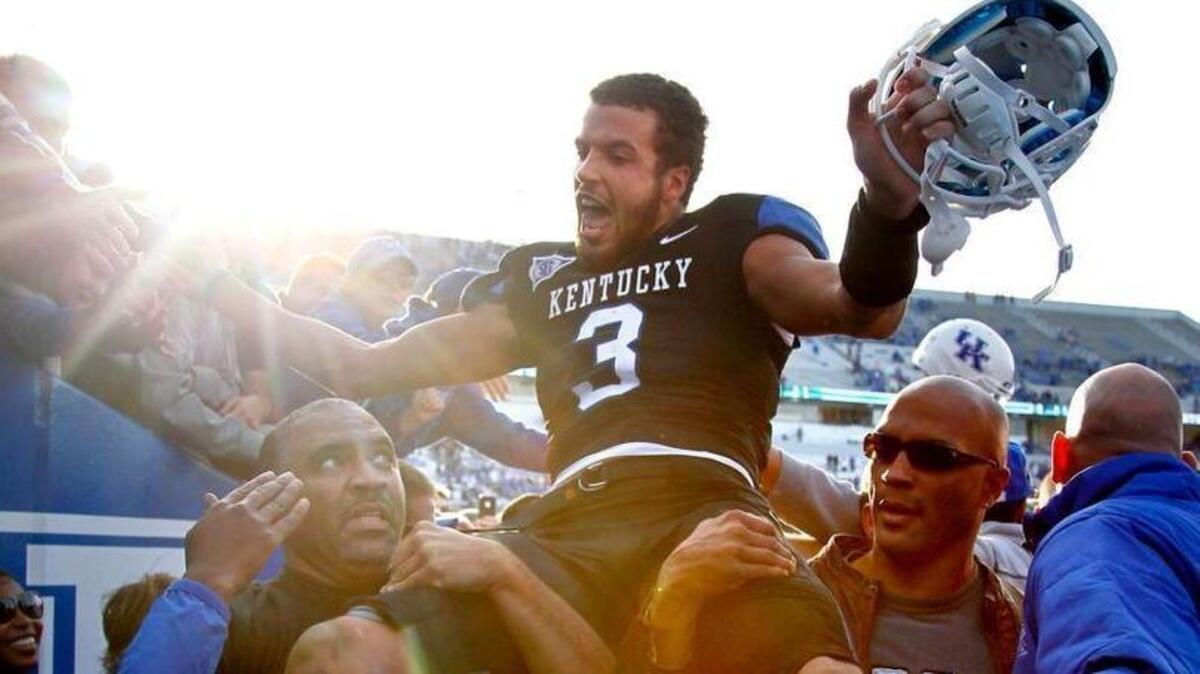Kentucky quarterback Matt Roark got a lift off the field as Kentucky defeated Tennessee 10-7 on Nov. 26, 2011.
