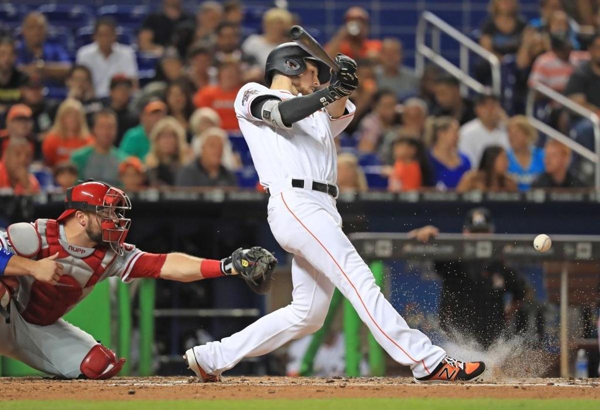Miami Marlins shortstop JT Riddle (39) triples in the third inning as the Miami Marlins play the Philadelphia Phillies at Marlins Park on Tuesday, July 18, 2017.