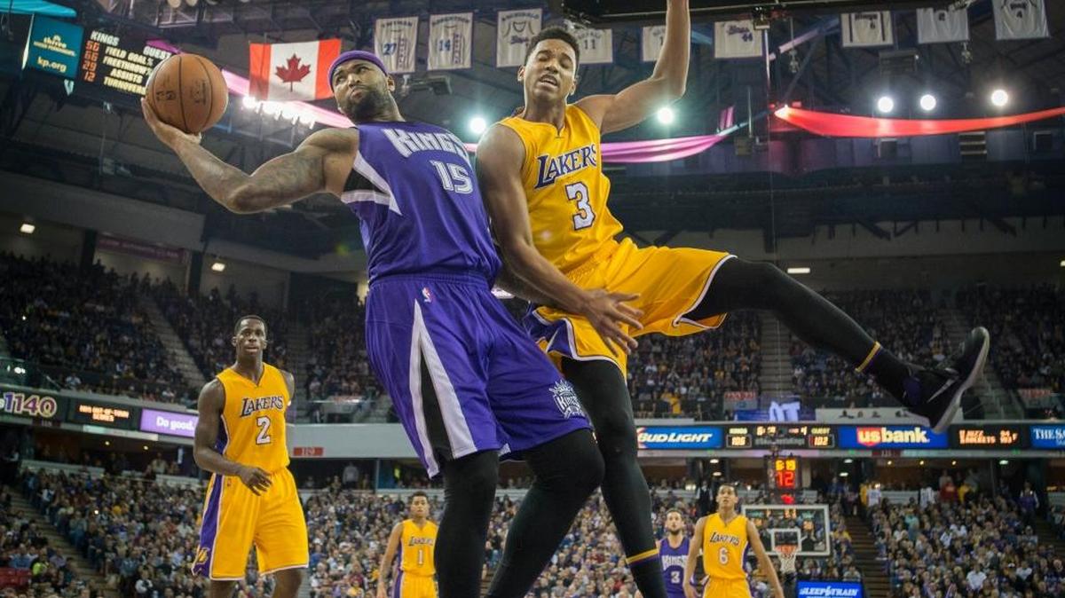 Kings forward DeMarcus Cousins (15) attempted to control the ball against Lakers forward Anthony Brown (3) on Jan. 7 in Sleep Train Arena in Sacramento, Calif.