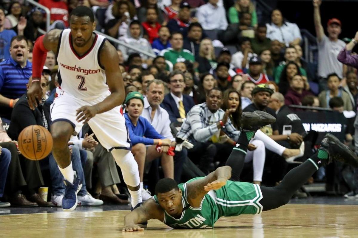 Boston Celtics guard Marcus Smart (36) dove after a ball stolen by Washington Wizards guard John Wall (2) during the first half in Game 3 of a second-round NBA playoff series on Thursday, May 4, 2017, in Washington.