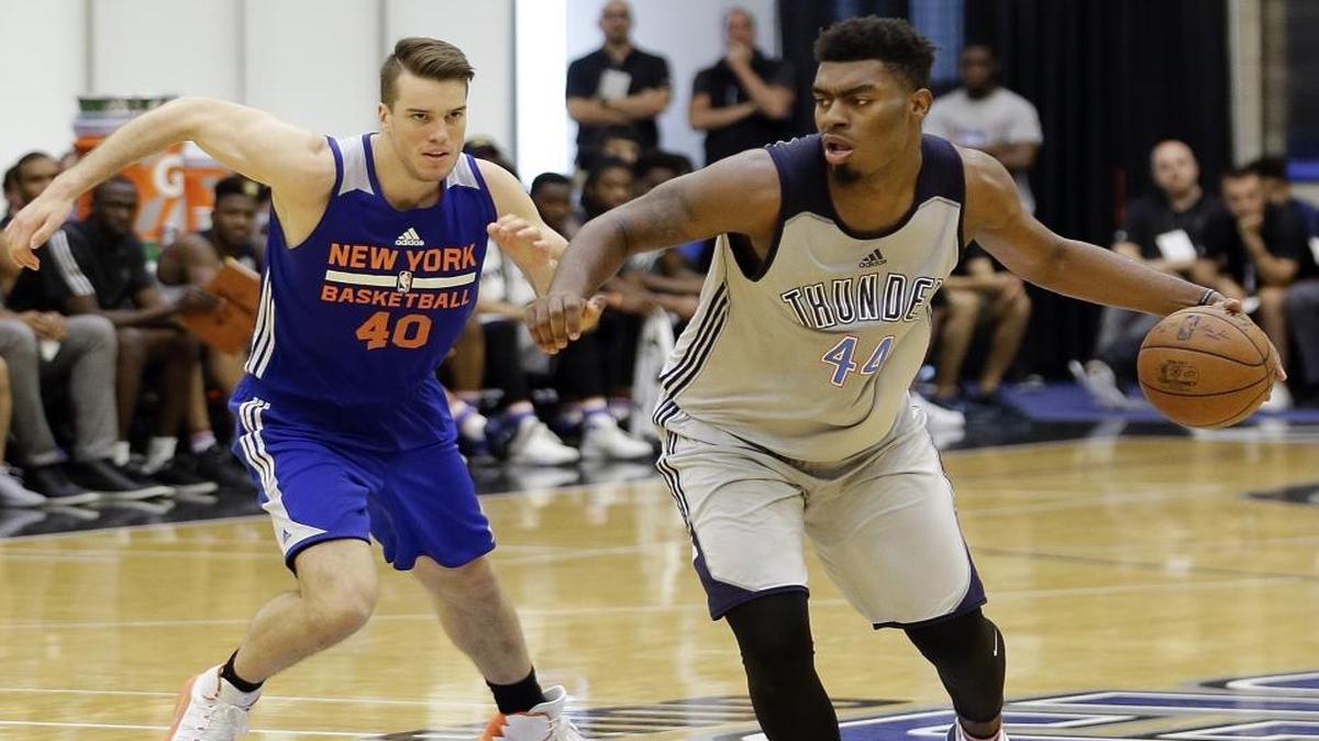 Oklahoma City’s Dakari Johnson drove around New York’s Marshall Plumlee during a Summer League game in Orlando on Monday.
