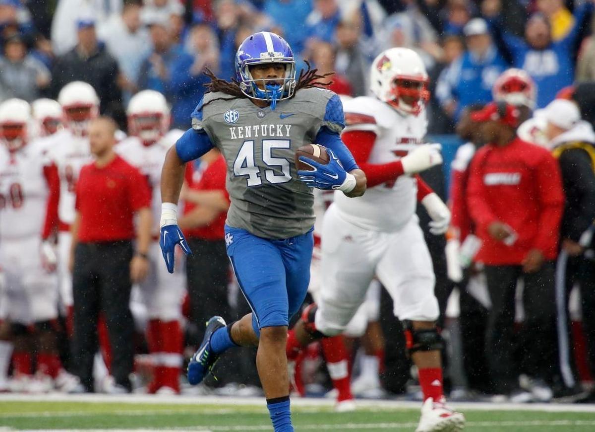 Kentucky linebacker Josh Forrest (45) returned an interception for a touchdown against Louisville at Commonwealth Stadium in Lexington on Nov. 28, 2015.