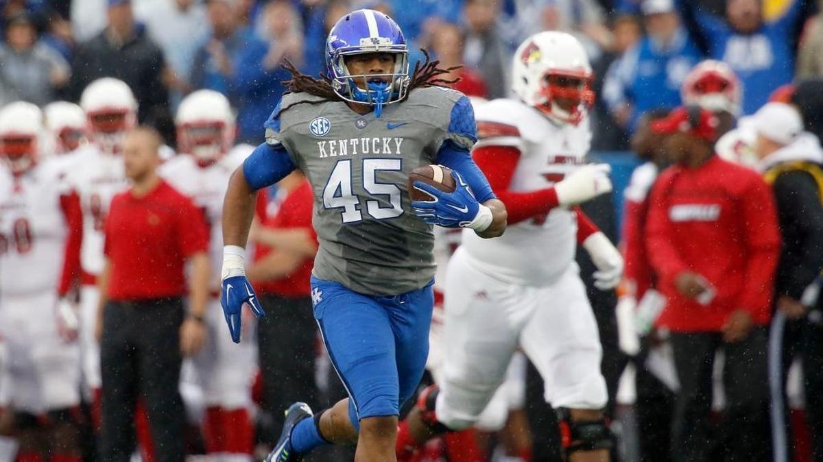 Kentucky linebacker Josh Forrest (45) returned an interception for a touchdown against Louisville at Commonwealth Stadium in Lexington on Nov. 28, 2015.