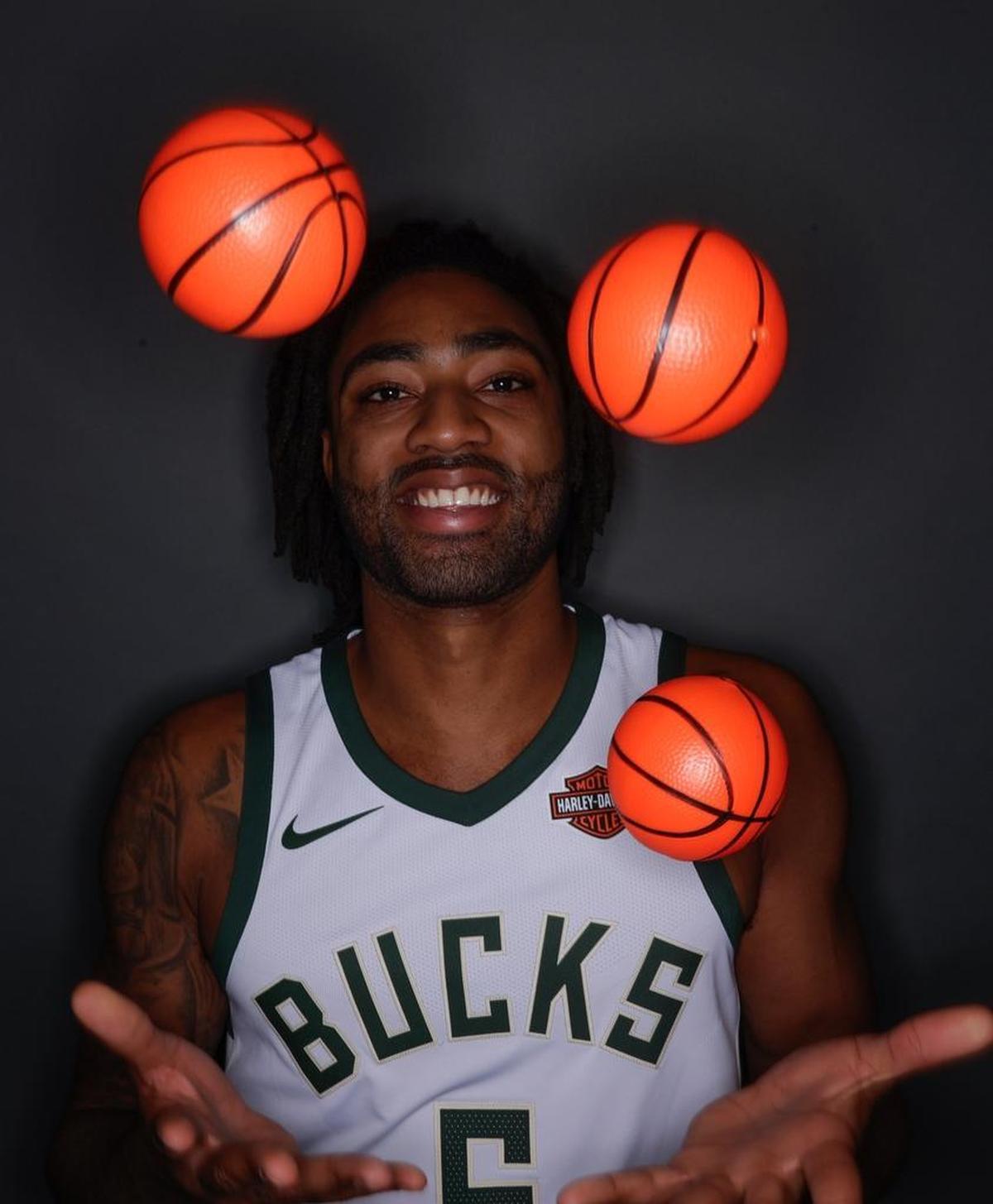 Milwaukee Bucks’ James Young juggles some small basketballs during NBA basketball team media day Monday, Sept. 25, 2017, in Milwaukee.