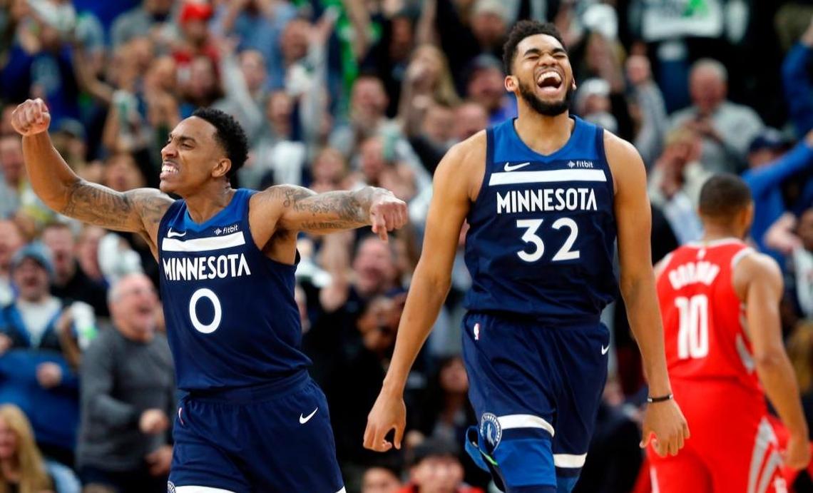 The Timberwolves’ Jeff Teague, left, and Karl-Anthony Towns celebratd a basket during Game 3 in an NBA basketball first-round playoff series against the Houston Rockets on Saturday.