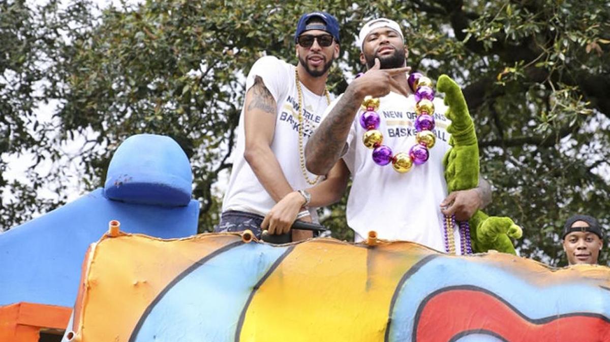 Anthony Davis and DeMarcus Cousins, who play for the New Orleans Pelicans, were honorary grand marshals of a Mardi Gras parade on Tuesday.