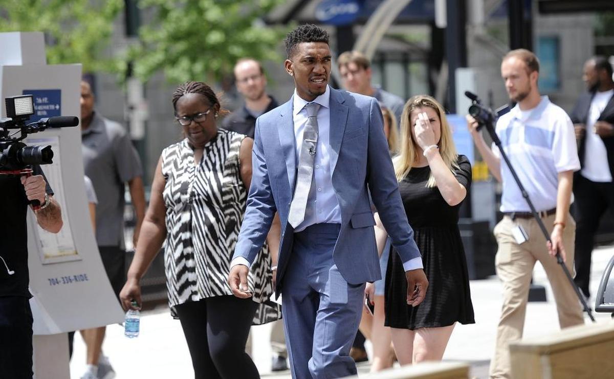 Charlotte Hornets draft pick Malik Monk looks over to the crowd of fans waiting at the 7th Street Market for him and fellow draft pick Dwayne Bacon on Friday, June 23, 2017.