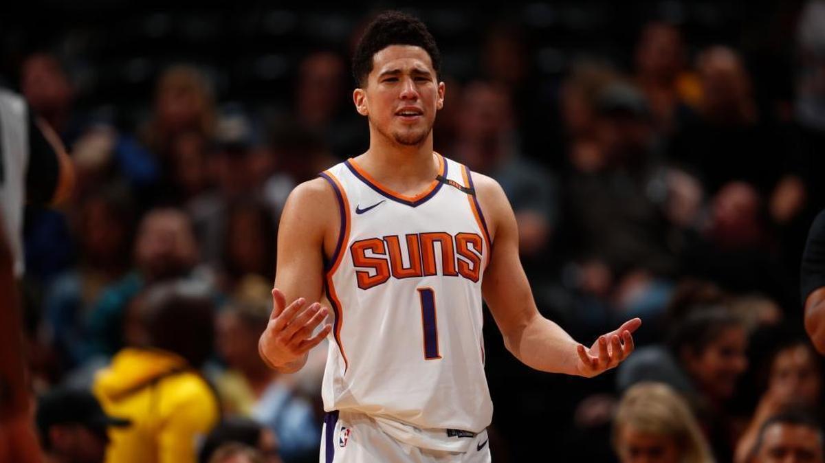 Phoenix Suns guard Devin Booker (1) in the second half of an NBA basketball game Friday, Jan. 19, 2018, in Denver. Phoenix won 108-100.