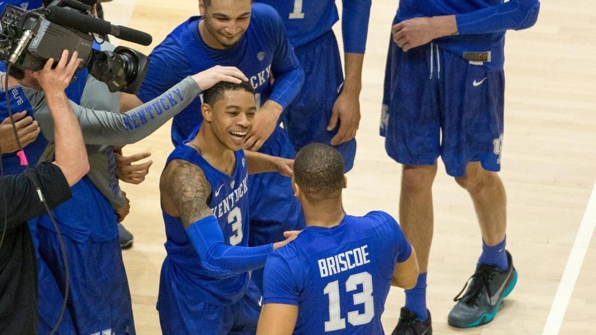 Kentucky Wildcats guard Tyler Ulis (3) congratulated Isaiah Briscoe (13) as it took overtime for UK to defeat Texas A&M 82-77 in the championship game of the SEC tournament on Sunday March 13, 2016 in Nashville, Tn.