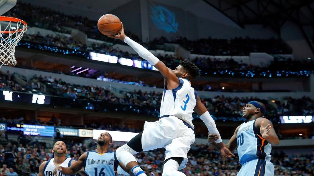 Dallas Mavericks forward Nerlens Noel (3) palms the ball as takes two long strides Memphis Grizzlies forward Zach Randolph (50) for a layup and the foul during the first half at the American Airlines Center on Friday, March 3, 2017 in Dallas.