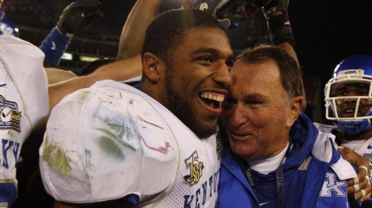 Former UK linebacker Wesley Woodyard embraced Coach Rich Brooks after the Wildcats beat Florida State 35-28 in the Music City Bowl in Nashville on Dec. 31, 2007. Woodyard was named Friday to the Kentucky Pro Football Hall of Fame.