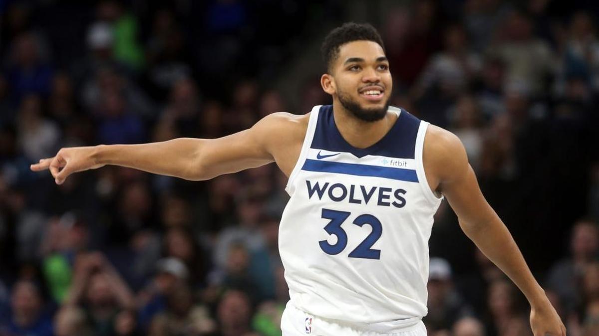Minnesota Timberwolves' Karl-Anthony Towns celebrates a three-point basket in the second half of an NBA basketball game against the New York Knicks, Friday, Jan. 12, 2018, in Minneapolis.