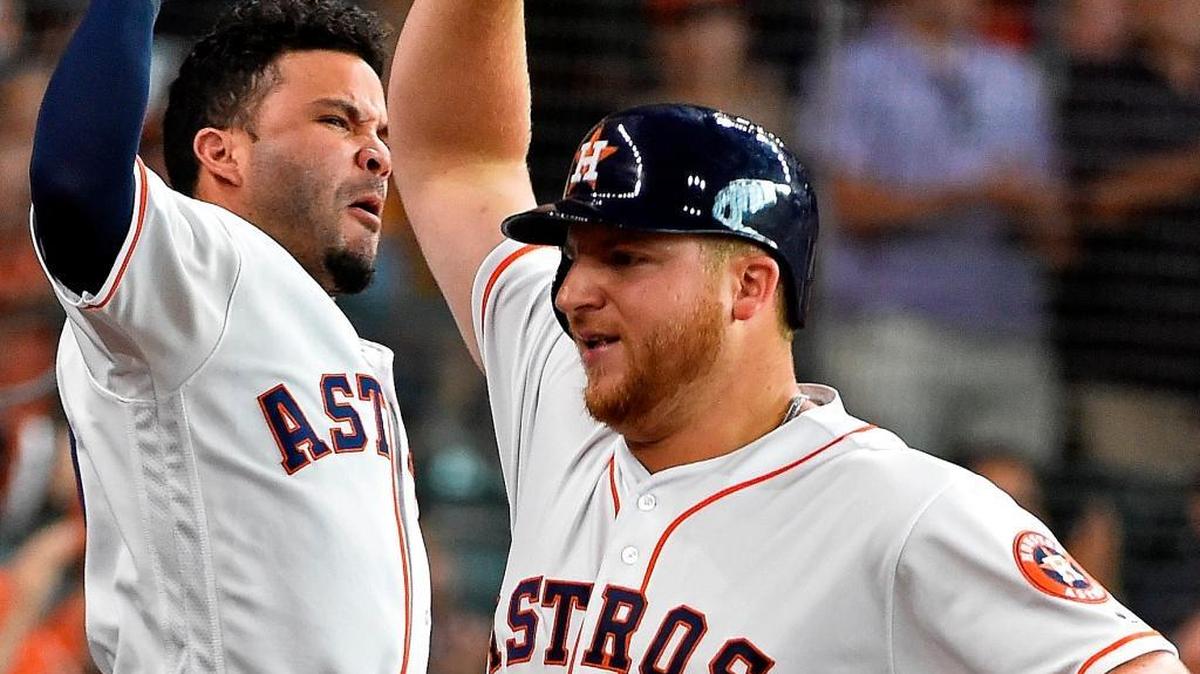 Houston Astros rookie A.J. Reed, right, celebrated his solo home run off Chicago White Sox relief pitcher David Robertson with Jose Altuve in the ninth inning of a baseball game, Saturday, July 2, 2016, in Houston. Reed's home run was the first home run of his Major League career. (AP Photo/Eric Christian Smith)