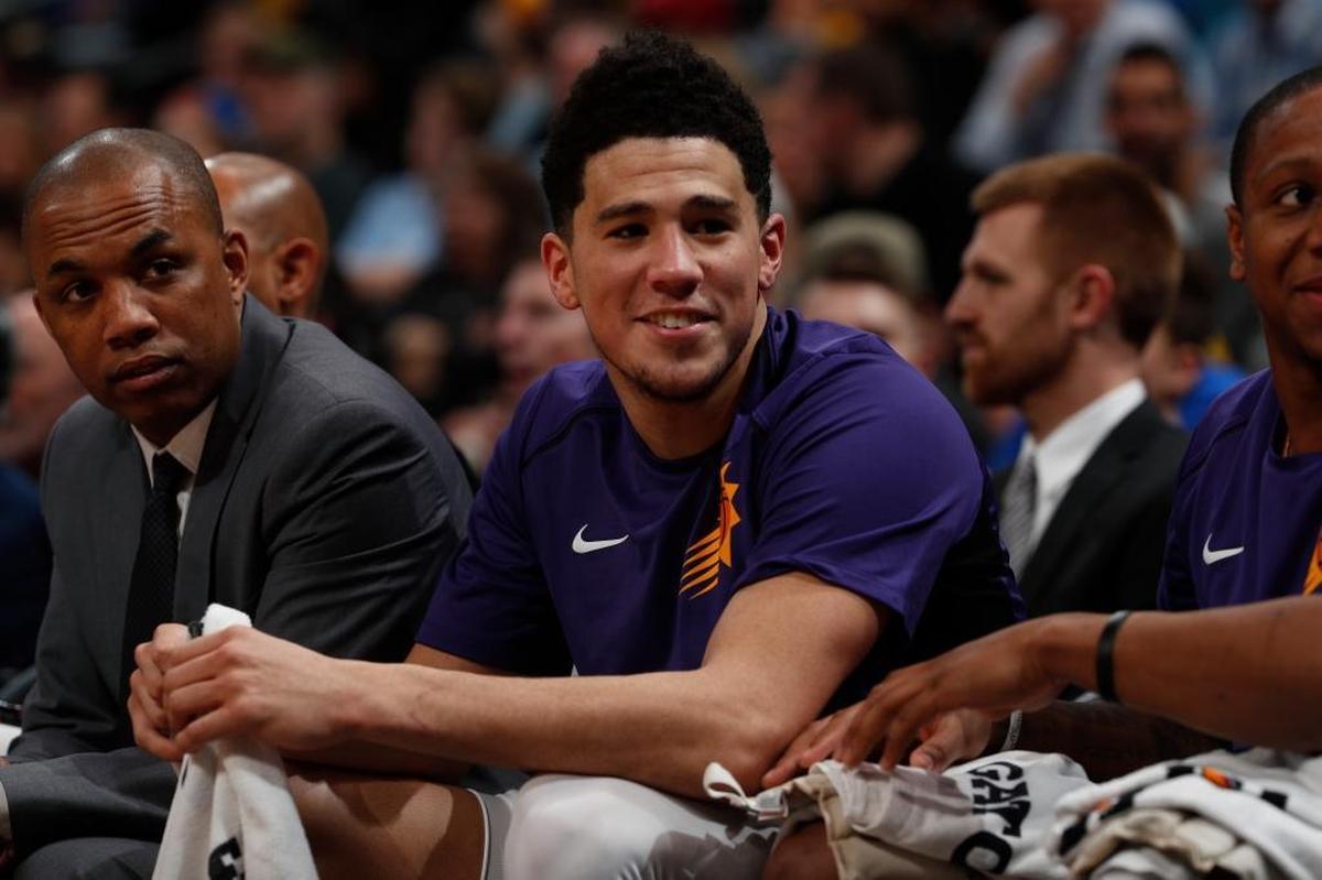 Phoenix Suns guard Devin Booker (1) in the second half of an NBA basketball game Friday, Jan. 19, 2018, in Denver. Phoenix won 108-100.