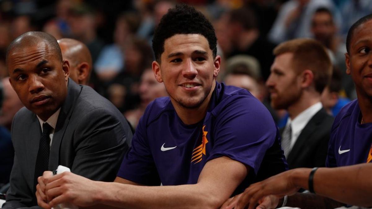 Phoenix Suns guard Devin Booker (1) in the second half of an NBA basketball game Friday, Jan. 19, 2018, in Denver. Phoenix won 108-100.