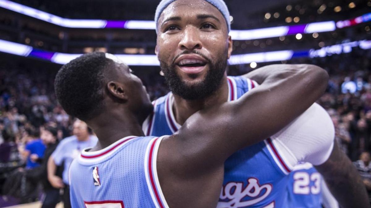 Sacramento Kings guard Darren Collison (7) congratulates teammate Sacramento Kings forward DeMarcus Cousins (15) after the victory against the Atlanta Hawks during their game at Golden 1 Center in Sacramento, Calif., on Friday, February 10, 2017.