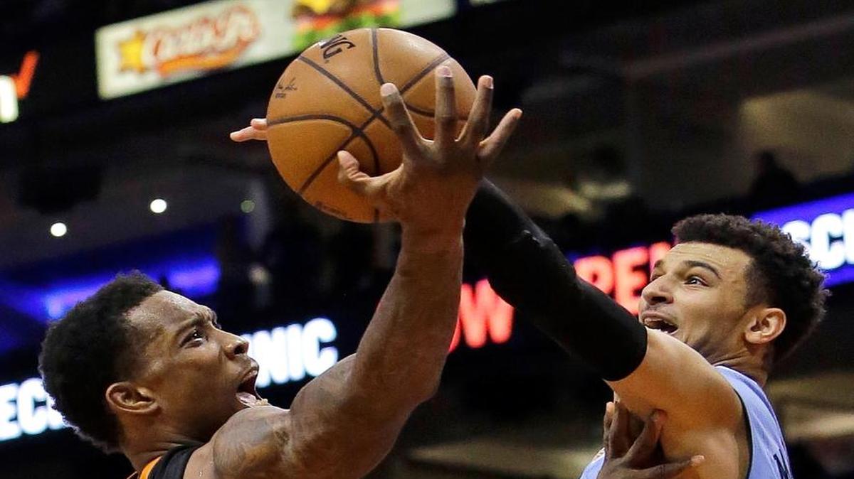 Denver Nuggets guard Jamal Murray (27) blocks the shot of Phoenix Suns guard Eric Bledsoe during the fourth quarter during an NBA basketball game, Saturday, Jan. 28, 2017, in Phoenix. Denver defeated Phoenix 123-112.