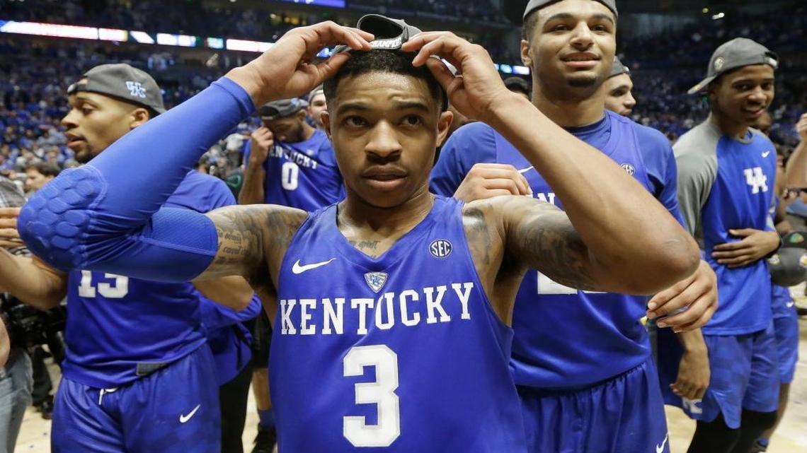 Kentucky's Tyler Ulis (3) celebrates with teammates after an NCAA college basketball game against Texas A&M in the championship of the Southeastern Conference tournament in Nashville on Sunday, March 13, 2016. Kentucky won 82-77 in overtime.