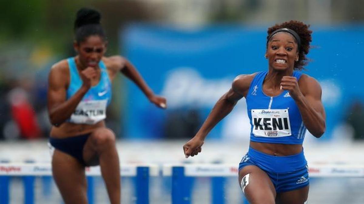 Kendra Harrison, center, races to the finish line ahead of Kristi Castlin, left, and Dawn Harper-Nelson, right, while winning the women's special 100-meter hurdles at the Drake Relays athletics meet, Saturday, April 29, 2017, in Des Moines, Iowa.