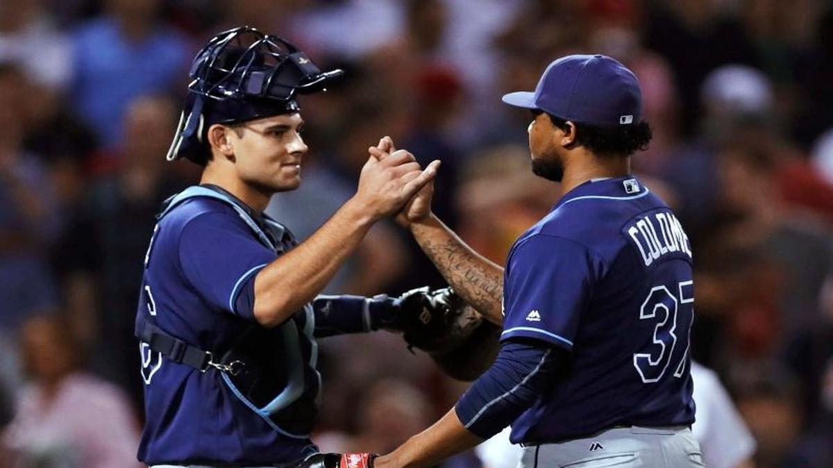Tampa Bay Rays relief pitcher Alex Colome (37) was congratulated by catcher Luke Maile after earning a save against the Boston Red Sox at Fenway Park on Tuesday, Aug. 30, 2016, in Boston.