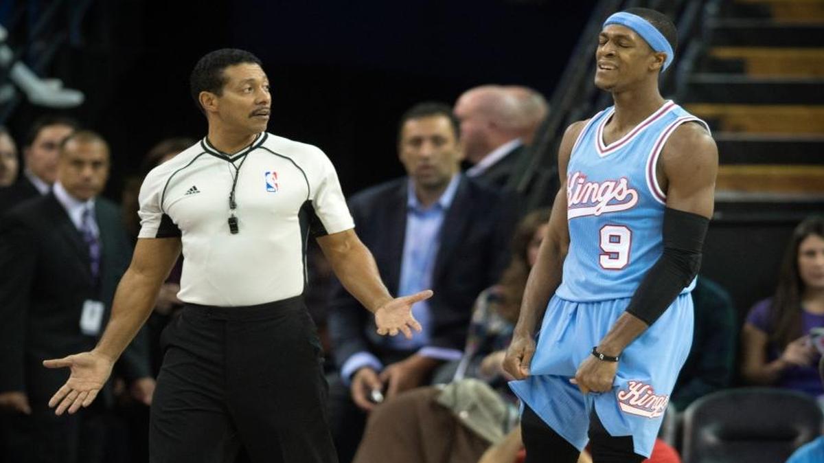 NBA referee Bill Kennedy (55) talked with Kings guard Rajon Rondo (9) during a game against the Timberwolves in Sacramento on Nov. 27. Rondo was suspended for a game after he was given a technical by Kennedy in Mexico City in early December.