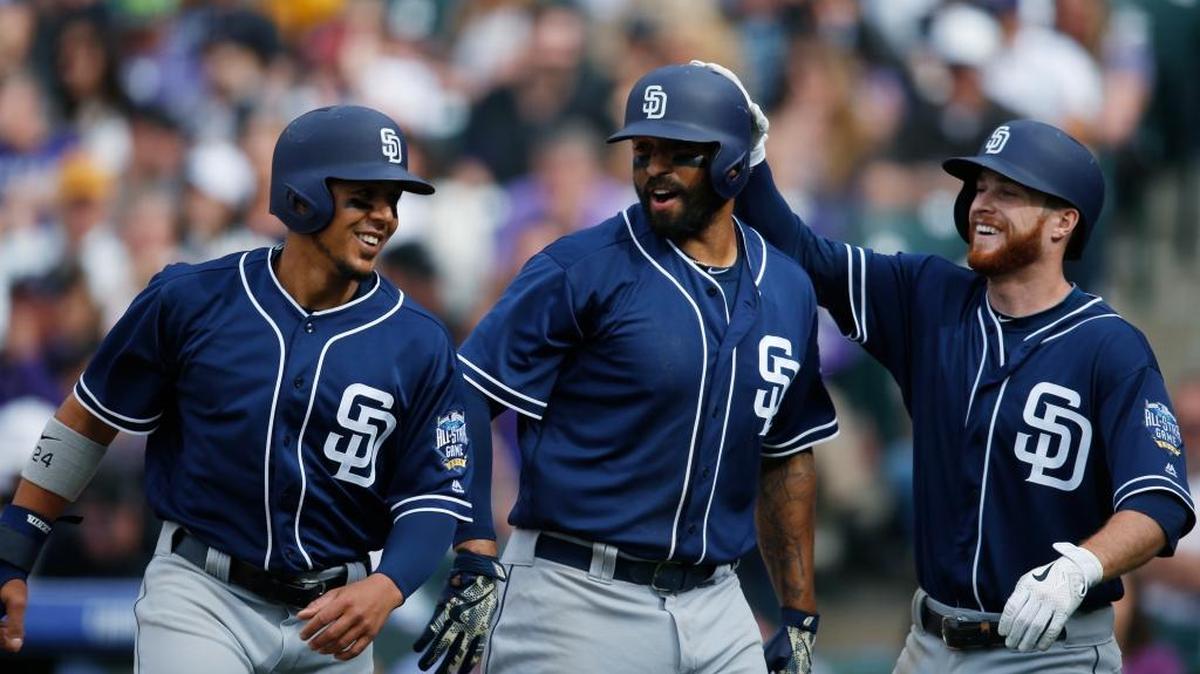 The San Diego Padres’ Matt Kemp, center, was congratulated by teammates Jon Jay, left, and Cory Spangenberg after hitting hit a three-run home run off Colorado Rockies relief pitcher Justin Miller in the fifth inning Friday, April 8, 2016, in Denver.
