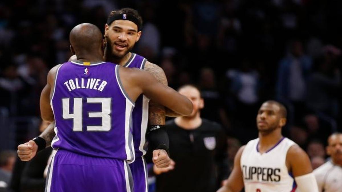 Sacramento Kings center Willie Cauley-Stein, celebrates with forward Anthony Tolliver, left, after scoring the go-ahead basket in an NBA basketball game while Los Angeles Clippers guard Chris Paul, second right, and guard Austin Rivers, right, look on, Sunday, March 26, 2017, in Los Angeles. The Kings won 98-97.