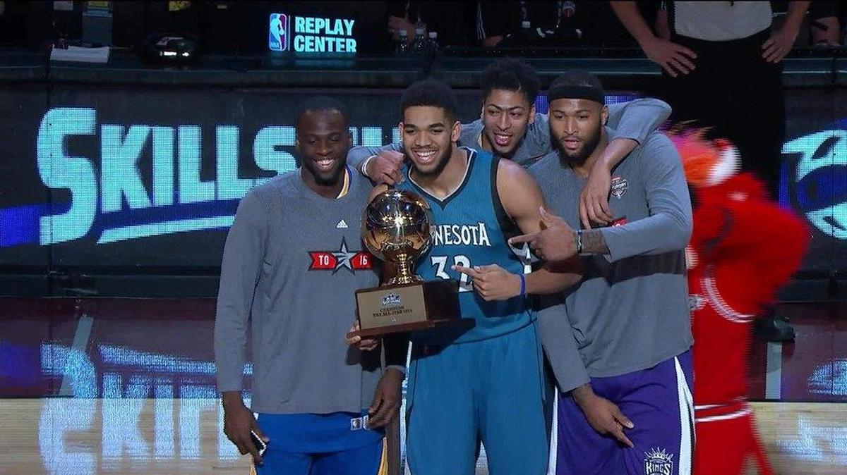 Karl-Anthony Towns (32) was congratulated by his fellow big men — Draymond Green, left, Anthony Davis and DeMarcus Cousins — after his victory over Isaiah Thomas in the NBA Skills Challenge finals.