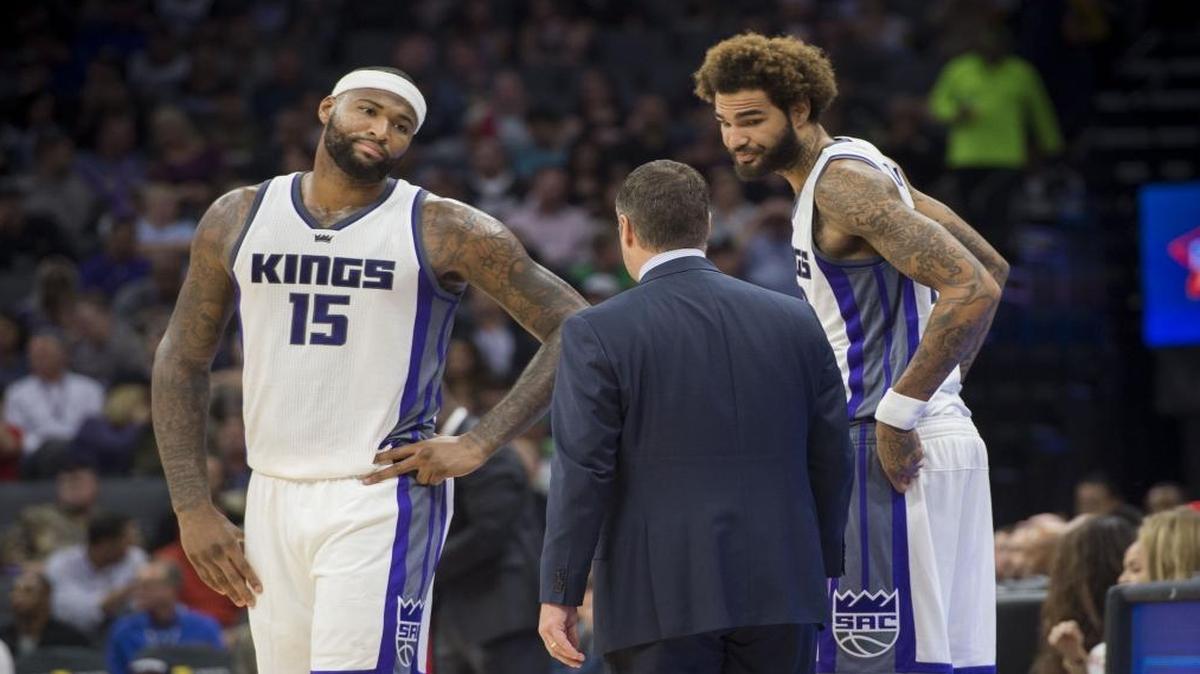 Sacramento Kings center DeMarcus Cousins (15) and Sacramento Kings center Willie Cauley-Stein (00) speak with Sacramento Kings head coach David Joerger during their game against the New Orleans Pelicans at the Golden 1 Center on Tuesday, November 8, 2016 in Sacramento.