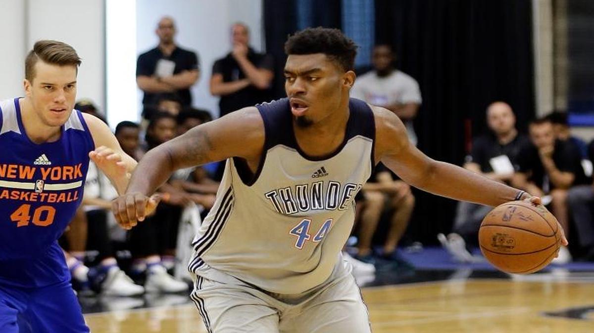 Oklahoma City Thunder's Dakari Johnson (44) drives around New York Knicks' Marshall Plumlee ( 40) during the second half of an NBA summer league basketball game, Monday, July 3, 2017, in Orlando, Fla. (AP Photo/John Raoux)