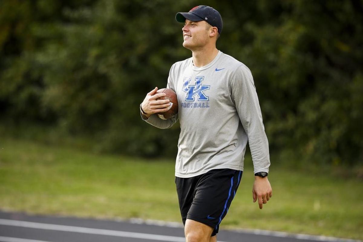 Former University of Kentucky quarterback Patrick Towles works with Paris High School quarterback Aaron Maggard, not pictured, during football practice at Blanton Collier Stadium in Paris, Ky., Thursday, Nov. 2, 2017.