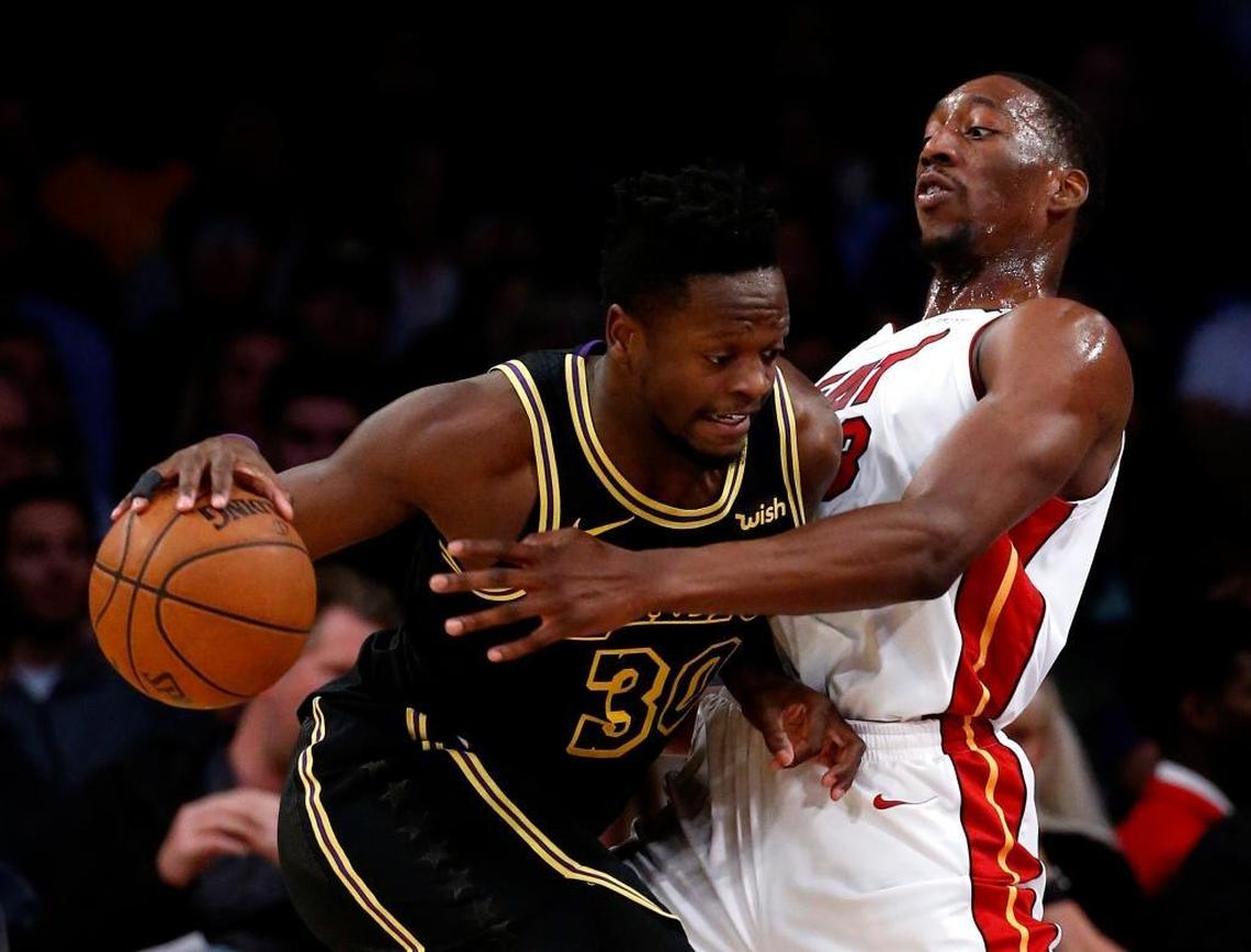 Lakers forward Julius Randle, left, drove against Heat center Bam Adebayo during the first half on March 16.